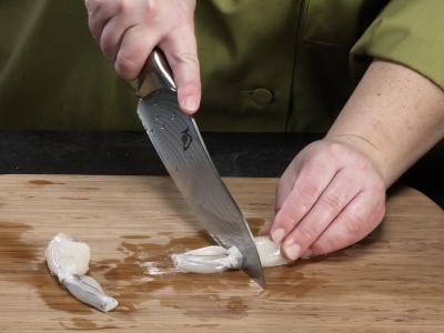 Learn How To Cook - How To Photo Pictorial Steps Frog Legs Split the leg in half at the knee. A Step-by-Step How To Photo Pictorial Learn How To Cook - How To Photo Pictorial Steps Frog Legs